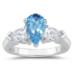 0.20 Cts Diamond & 3.18 Cts Swiss Blue Topaz Three Stone Ring in 18K White Gold